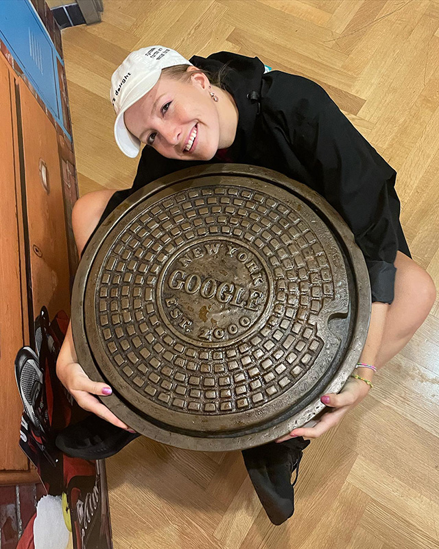 Holding A Google NYC Manhole
