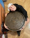 Holding A Google NYC Manhole